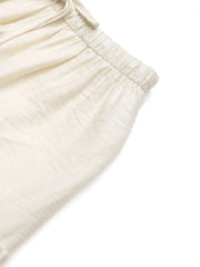 Cream textured tiered midi skirt with elastic waistband and drawstring detail.