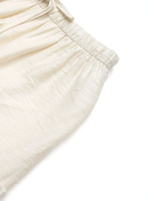 Cream textured tiered midi skirt with elastic waistband and drawstring detail.