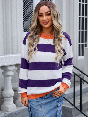 Sunset Stripe Colorblock Knit sweater with purple, white, and orange stripes, crew neck, long sleeves.