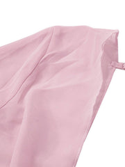 Pink chiffon mini dress with draped detail and adjustable strap.