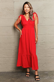 Red polyester midi dress with empire waist, tie straps, and tiered hem.