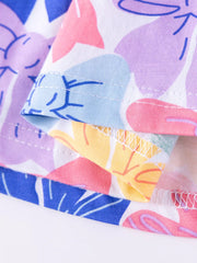 Baby dress with playful bow print, tiered hem detail, cotton fabric.