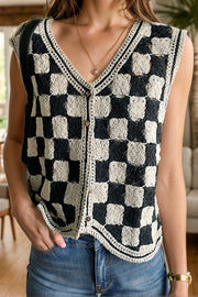 Checkerboard crochet vest with v-neck and button front in black and cream.