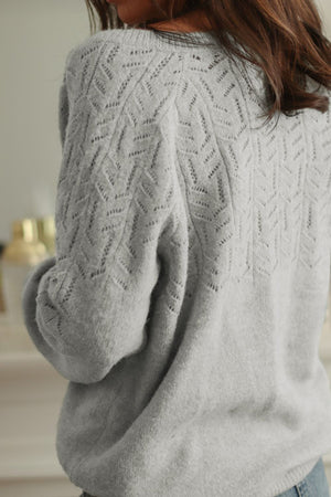 Gray lace-effect knit cardigan with chevron pattern detail on back and sleeves.