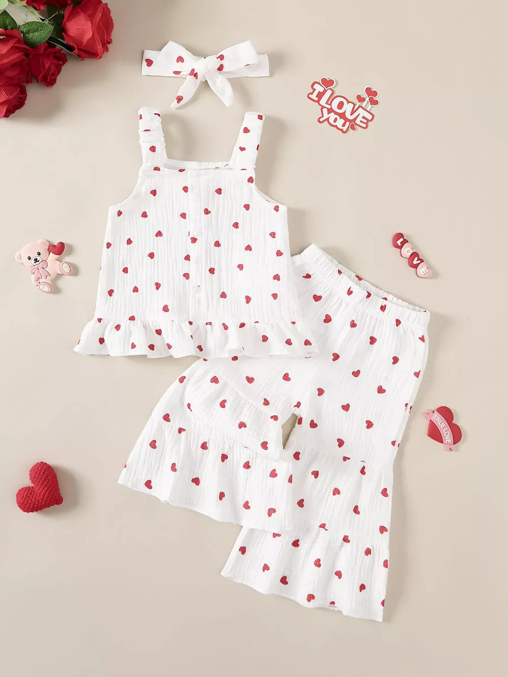 White baby set with red hearts, ruffled hem tank top, shorts, and headband.