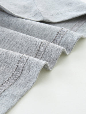 Grey cotton t-shirt detail showing hem stitching
