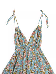 Vibrant floral print mini dress with tie-strap halter neckline and deep V-neck.