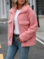 Teddy shearling zip-up jacket in pink with two chest pockets and a collar.