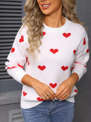 White acrylic sweater with red heart print, crew neck, long sleeves.