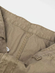 Khaki cargo pants with visible stitching and button closure detail.