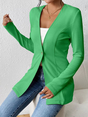 Green single-button blazer with textured fabric and tailored fit.