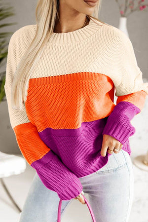 Colorblock ribbed knit pullover sweater in cream, orange, and purple with crew neck.