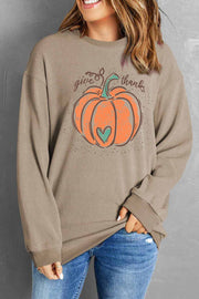 Ribbed tan sweatshirt with pumpkin graphic and "give thanks" text, 100% polyester