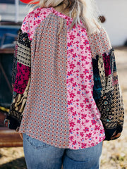 Boho floral patchwork blouse in fuchsia pink with drop shoulders and bubble sleeves.