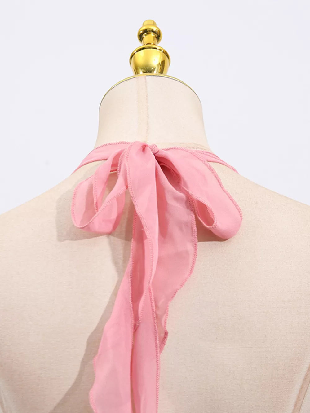Pink halter dress with chiffon tie detail on back