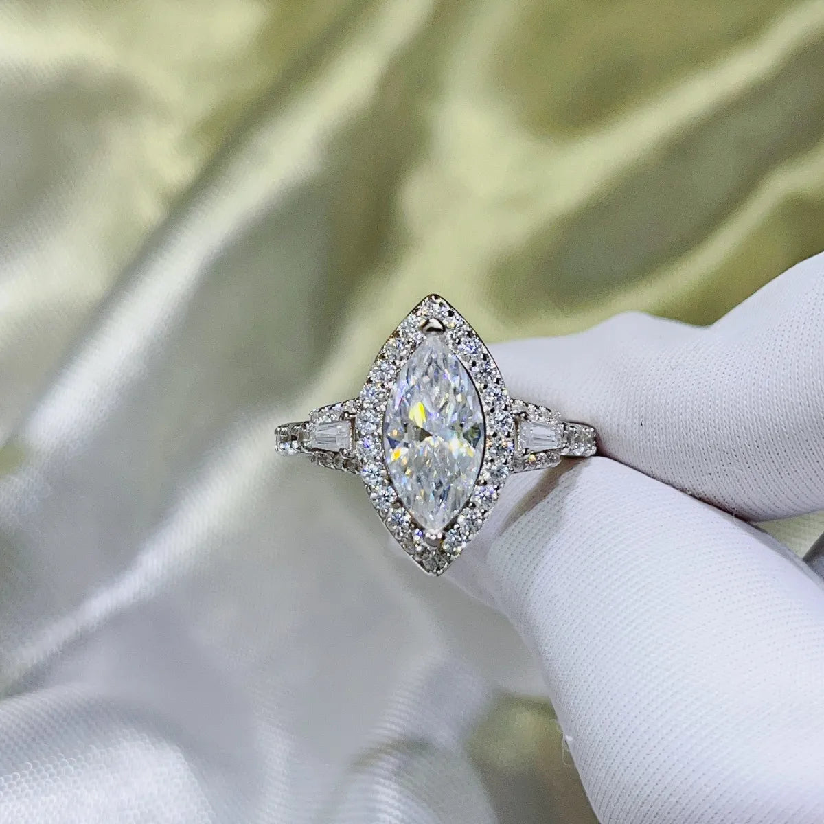 White Marquise Halo Moissanite Engagement Ring with baguette and round accent stones.
