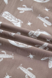 Brown cotton joggers with white cactus and cowboy boot print