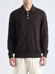 Brown knit polo shirt with button accents and textured pattern.
