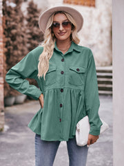Turquoise corduroy peplum shirt jacket with button front and chest pockets.