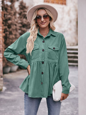 Turquoise corduroy peplum shirt jacket with button front and chest pockets.
