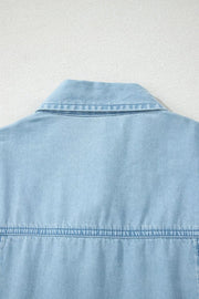Light blue denim midi dress with collar and button details.