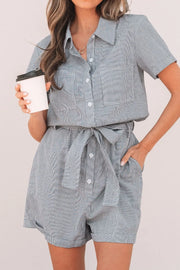 Pinstripe shirred waist romper with tie and short sleeves, featuring button front and chest pockets.