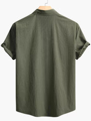 Army green cotton casual shirt with Cuban collar and textured fabric.