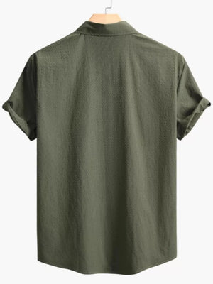 Army green cotton casual shirt with Cuban collar and textured fabric.