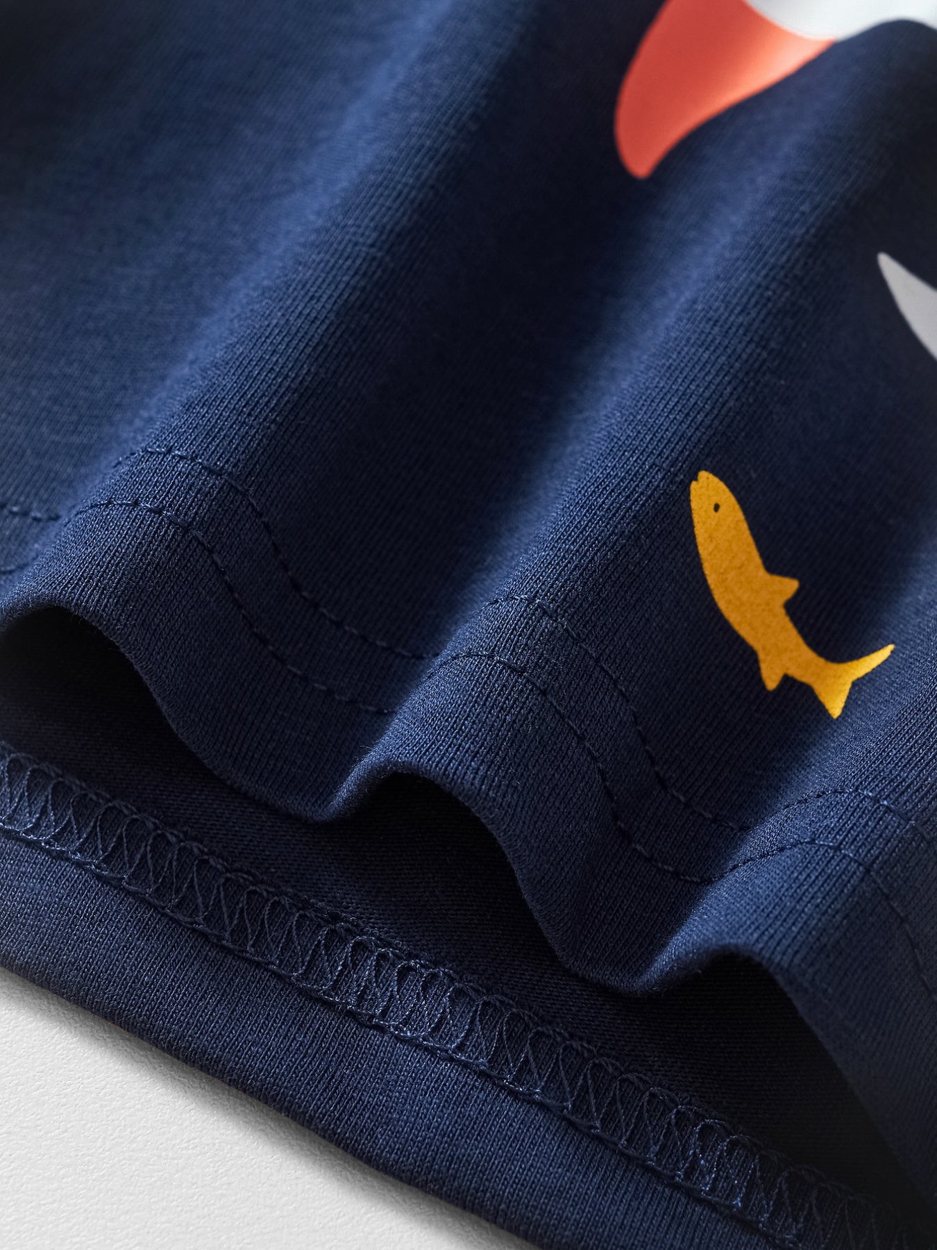 Navy cotton t-shirt with whimsical shark print and crew neck.
