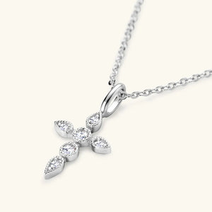 Silver cross pendant necklace with clear diamonds and a delicate chain.