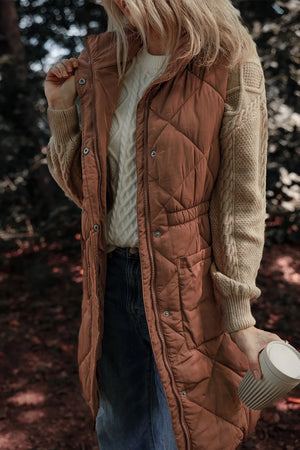 Brown diamond quilted longline vest with cinched waist detail and snap front.