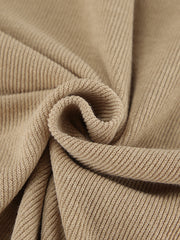 Beige ribbed knit fabric detail of a cowl-neck turtleneck and pants set.