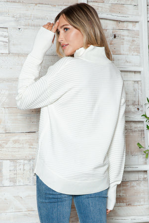 White ribbed knit funnel neck sweater with long sleeves and a relaxed fit.