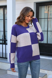 Checkerboard knit crewneck sweater in indigo and beige acrylic with crew neck and long sleeves.