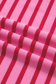 Maxi tee dress in pink with red stripes, cotton fabric, close-up view.