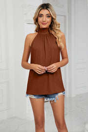 Brown halter neck blouse with ruched neckline and sleeveless design