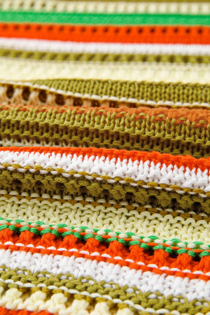 Striped crochet mini dress in orange, green, white, and yellow acrylic knit with open stitch details.