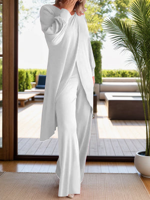 White draped overlay palazzo co-ord set with wide leg pants and long sleeves.