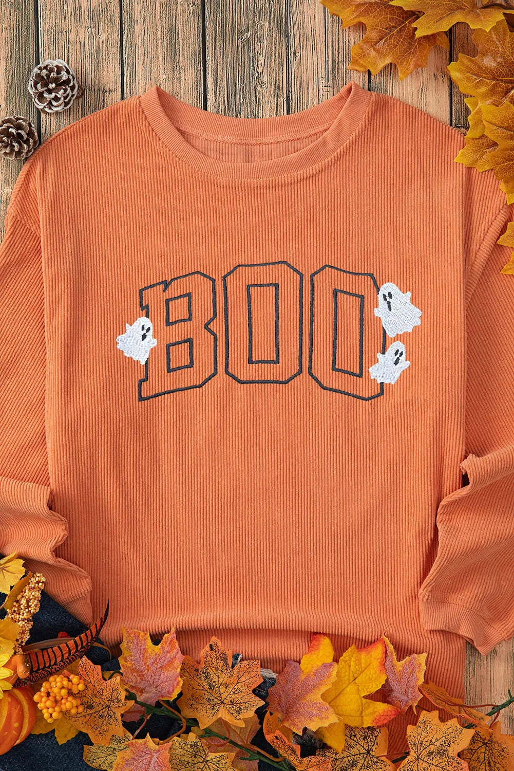 Orange corduroy sweatshirt with "BOO" appliqué and ghost details
