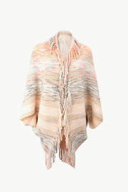 Textured stripe fringe cape in multi-color acrylic with a relaxed fit and open front.