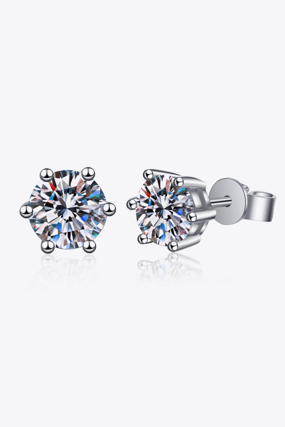 Six-prong solitaire stud earrings in silver with clear cubic zirconia stones.