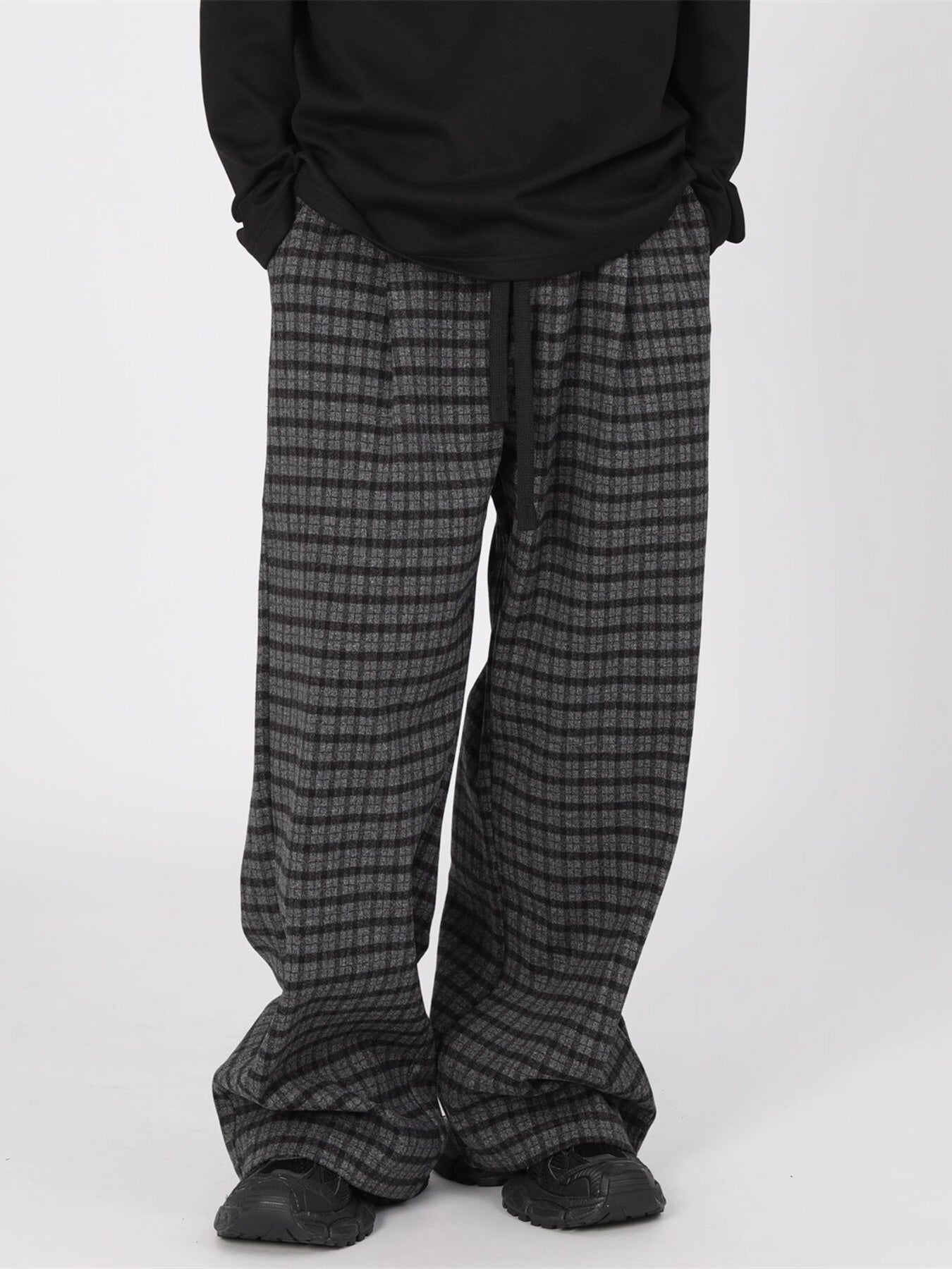Men's plus size plaid wide leg trousers in grey and black with drawstring waist.