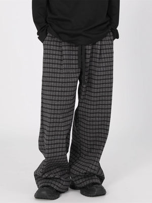 Men's plus size plaid wide leg trousers in grey and black with drawstring waist.