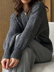 Gray cable-knit button-down cardigan with textured knit and ribbed cuffs.