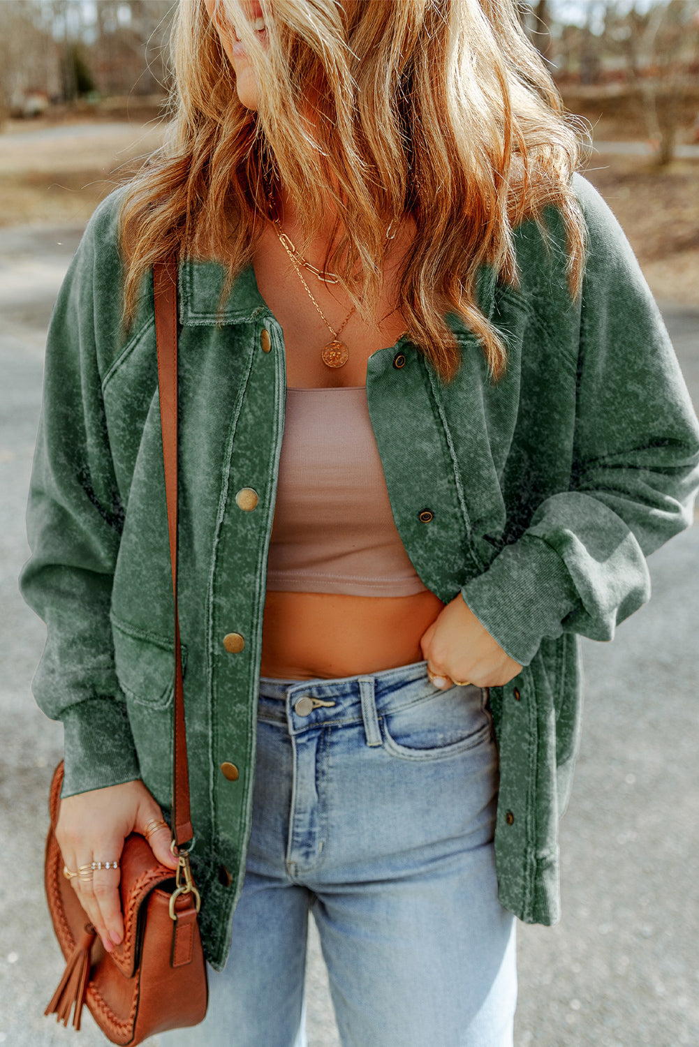 Green washed cotton utility jacket with snap buttons and chest pockets.