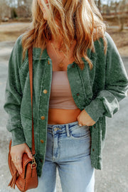 Green washed cotton utility jacket with snap buttons and chest pockets.