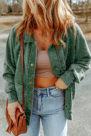 Green washed cotton utility jacket with snap buttons and chest pockets.