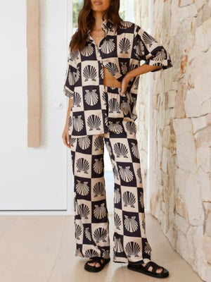 Black silk pajama set with shell print and buttoned top