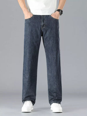 Men's navy straight leg cotton jeans with classic five-pocket styling.