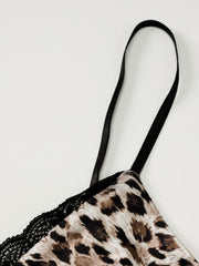 Leopard print cami top with black lace trim and adjustable spaghetti straps.